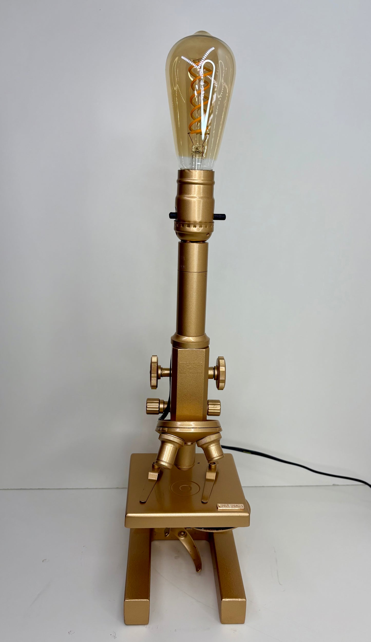 Microscopio Oro